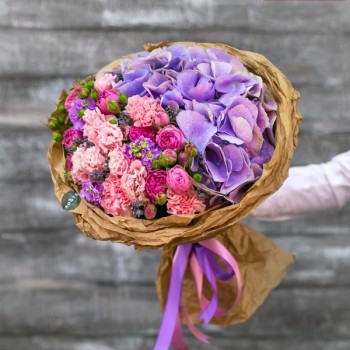 Delicate bouquet of hydrangea and bush roses